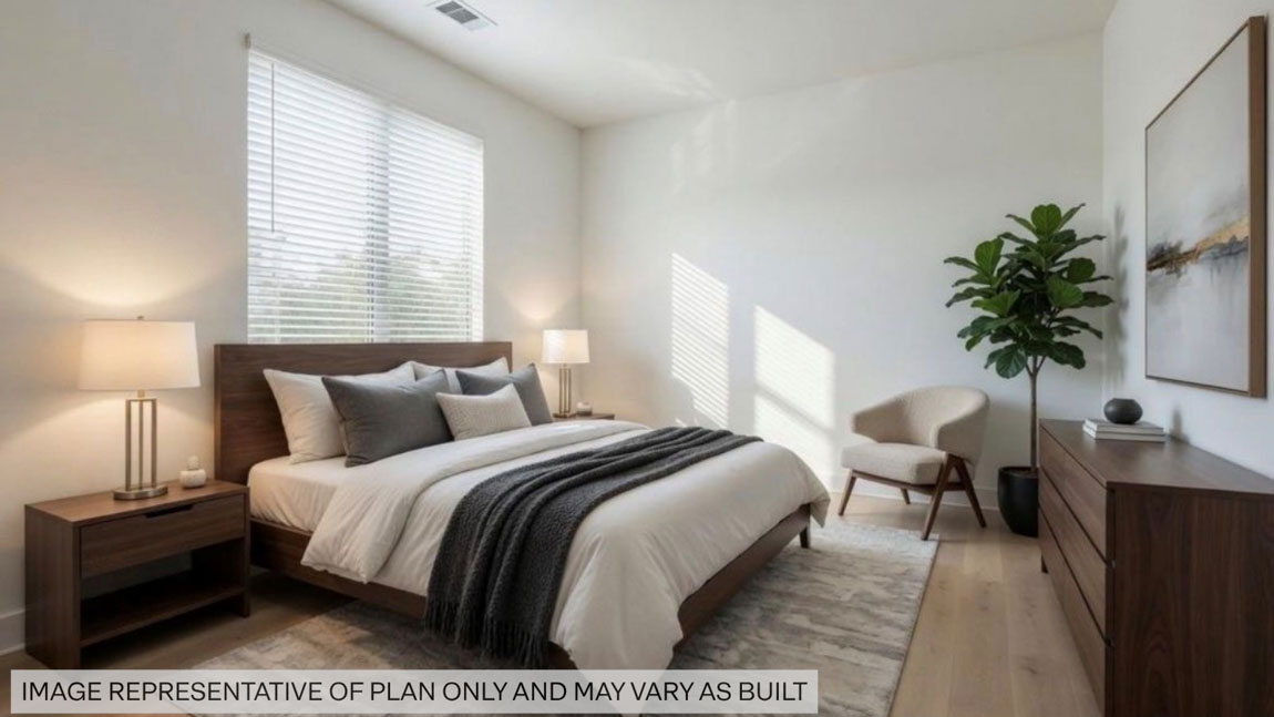 Secondary bedroom with shag carpet flooring and bright window