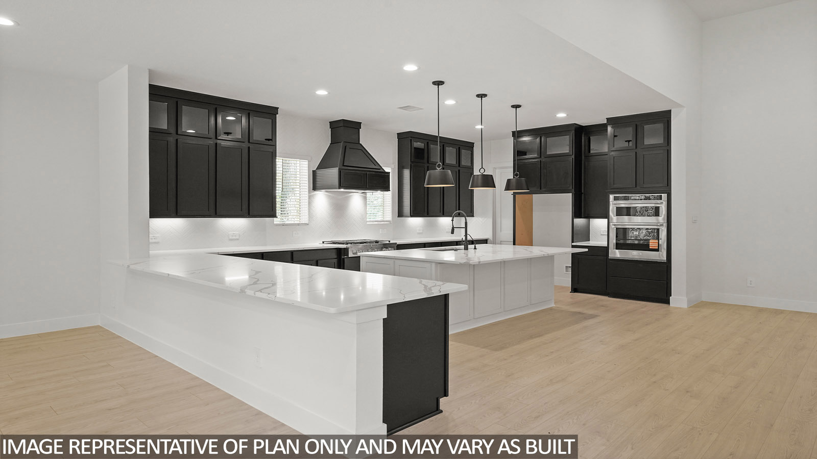L- shaped kitchen with an island and quartz counter tops