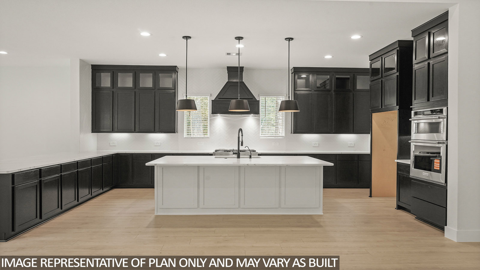 L- shaped kitchen with an island and quartz counter tops