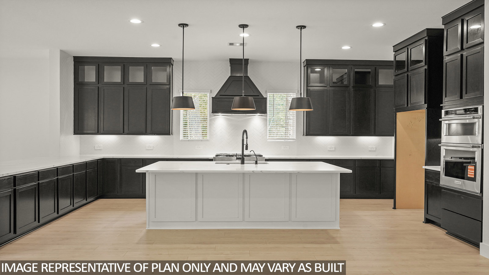 L- shaped kitchen with an island and quartz counter tops