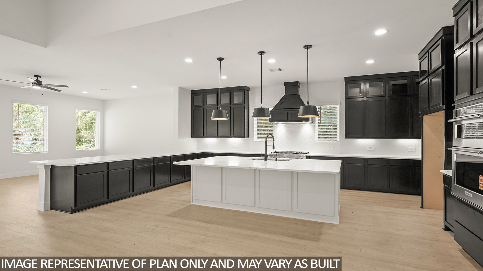 L- shaped kitchen with an island and quartz counter tops