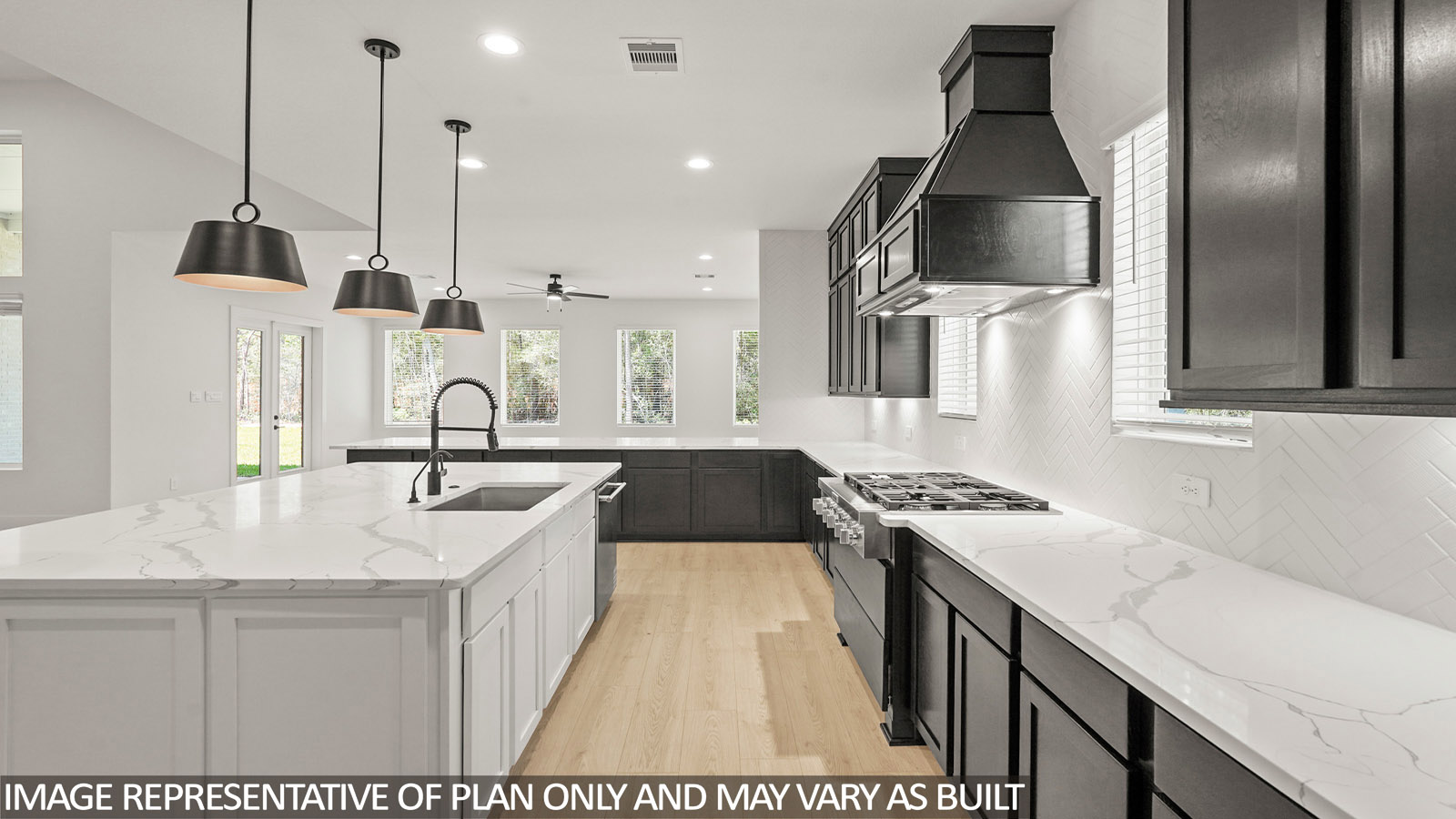 L- shaped kitchen with an island and quartz counter tops