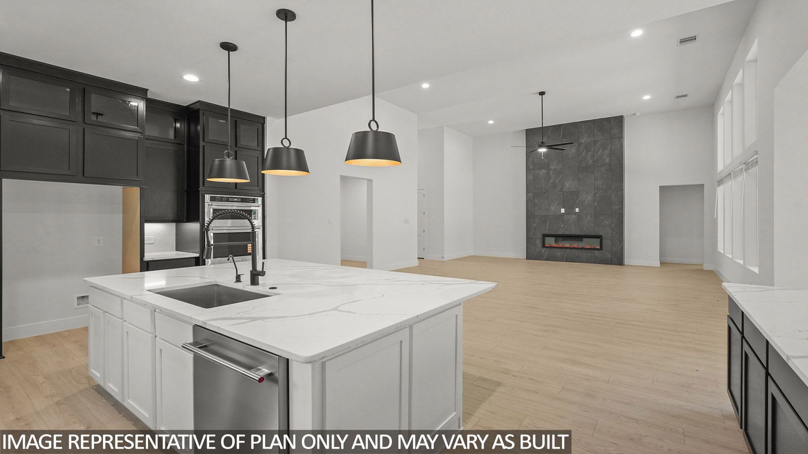 L- shaped kitchen with an island and quartz counter tops