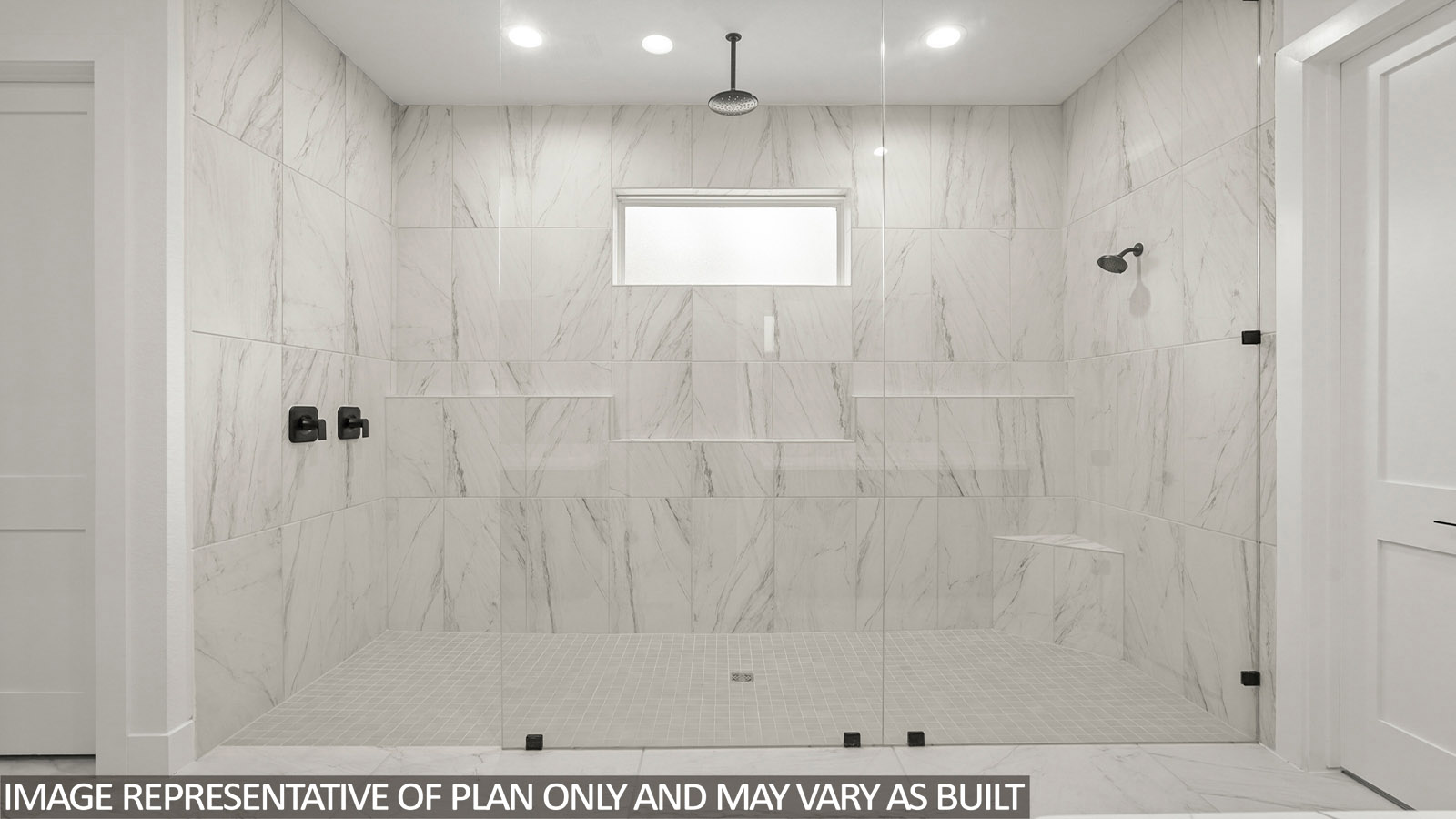Primary bathroom with super shower with tiled wall and semi frameless glass in Pinehurst  TX