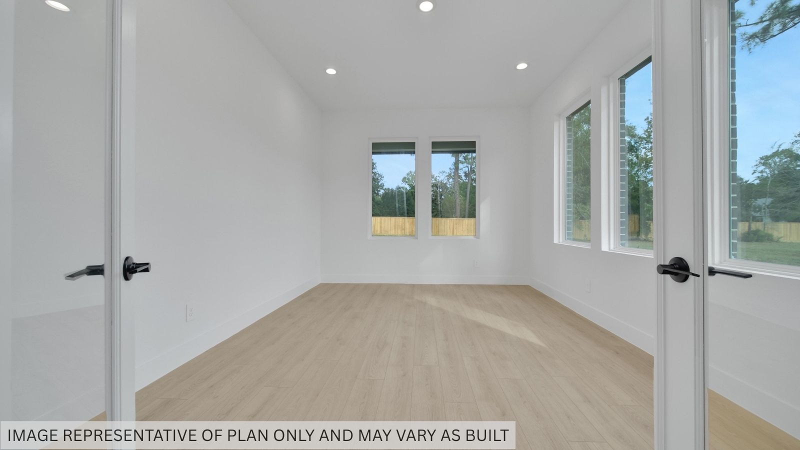 Bonus room with bright windows and vinyl flooring