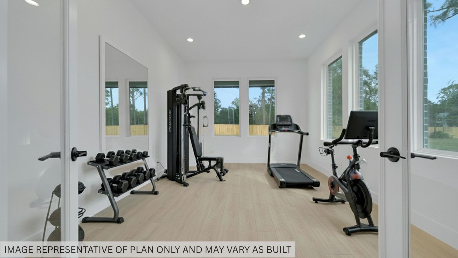Gym room with windoes and vinyl flooring