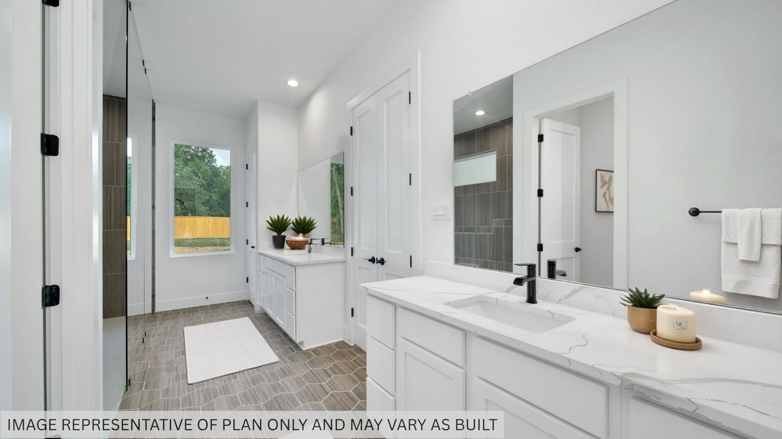 Primary bathroom with double sinks and a super shower