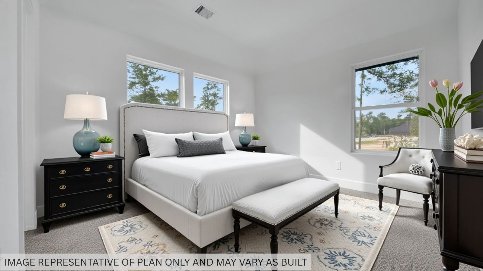 Secondary bedroom with carpet flooring