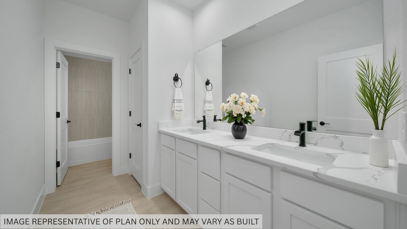 Secondary bathroom with stand alone shower and double sinks