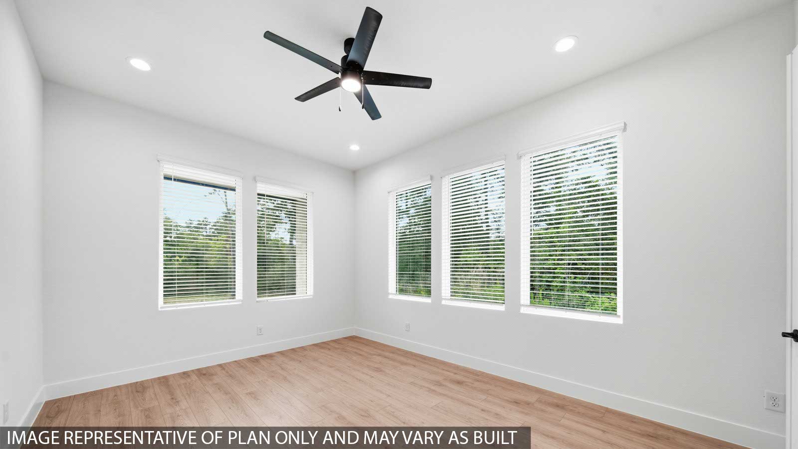 Large Primary bedroom with ceiling fan, vinyl flooring and bright window