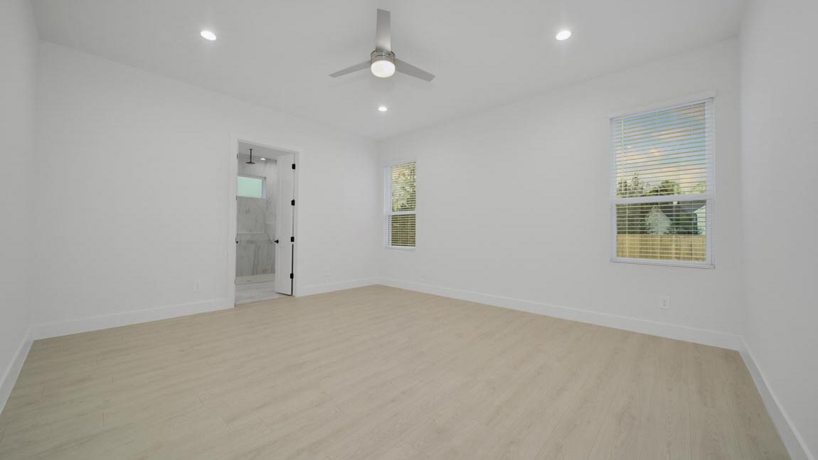 Primary bedroom with carpet flooring