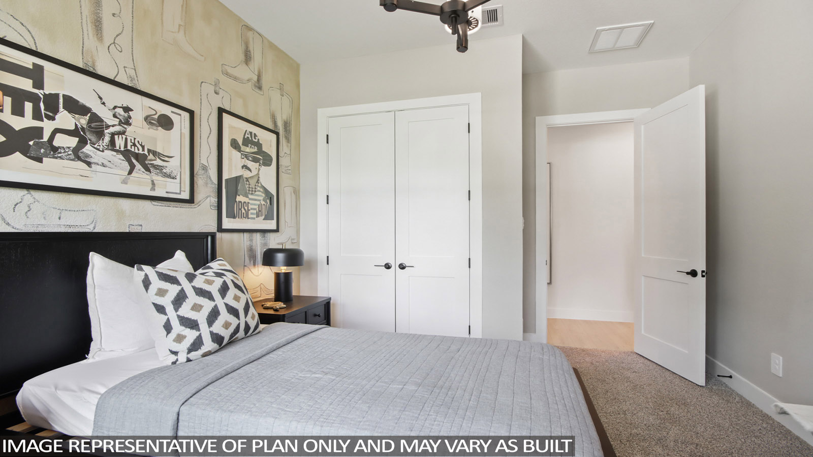 Secondary bedroom with carpet flooring