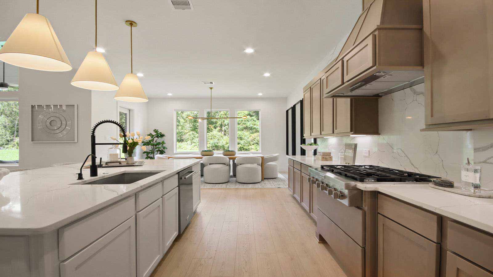 L- shaped kitchen with an island and quartz counter tops