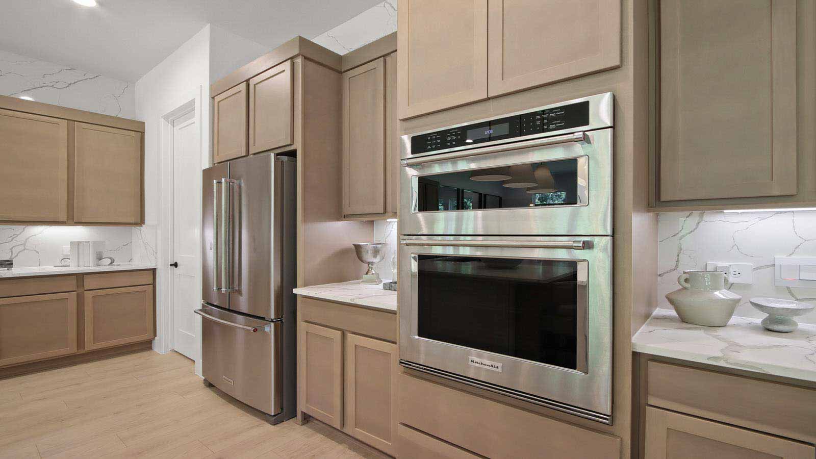 L- shaped kitchen with an island and quartz counter tops