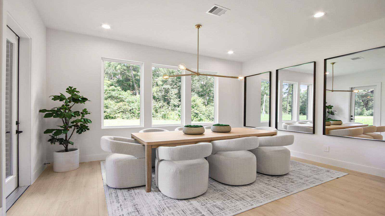 Dining area with vinyl flooring located off from the living room area in Pinehurst TX
