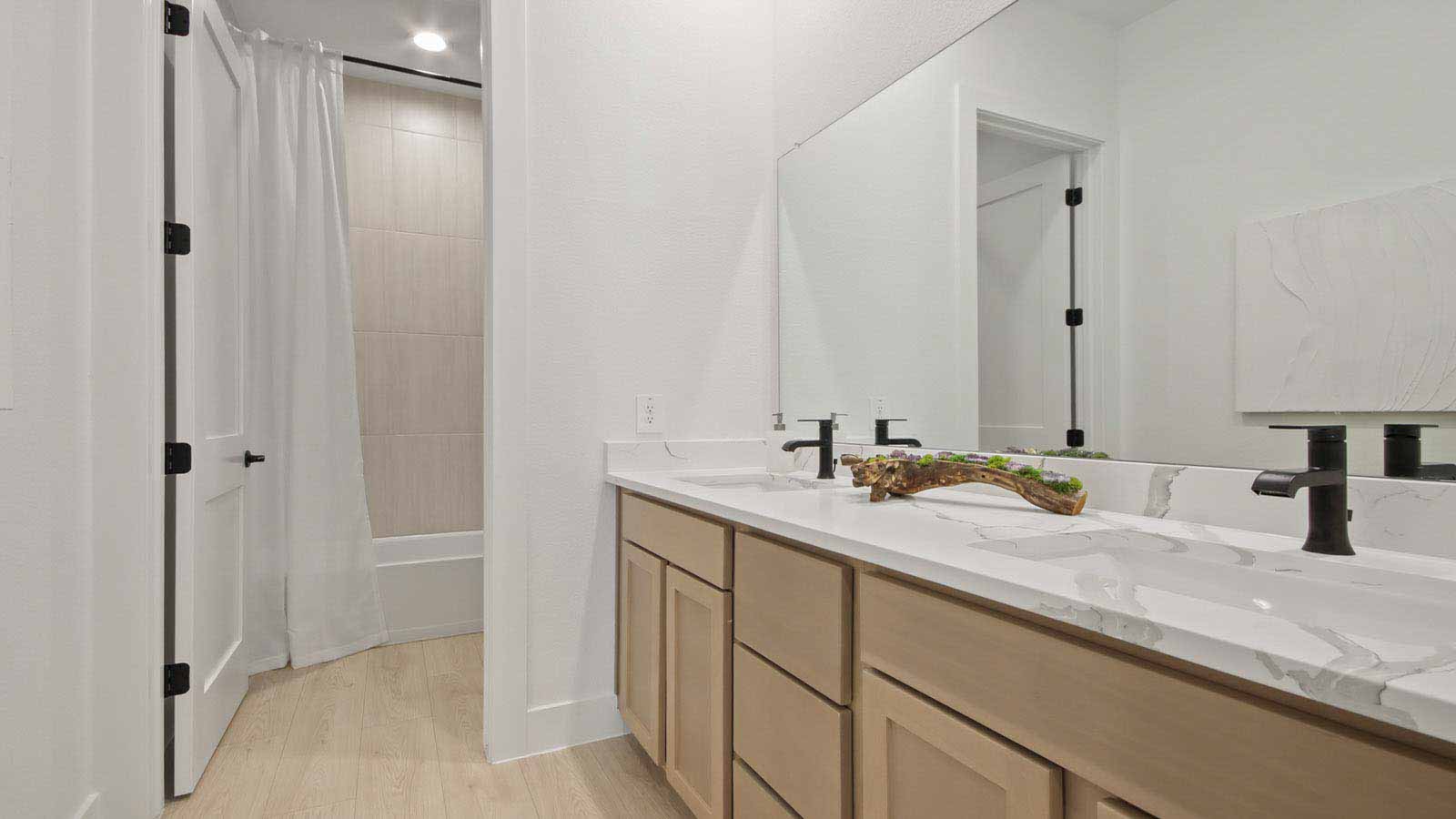 Secondary bathroom with double sinks quartz counter tops in Pinehurst  TX