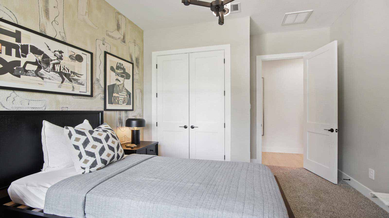 Secondary bedroom with shag carpet flooring and bright window