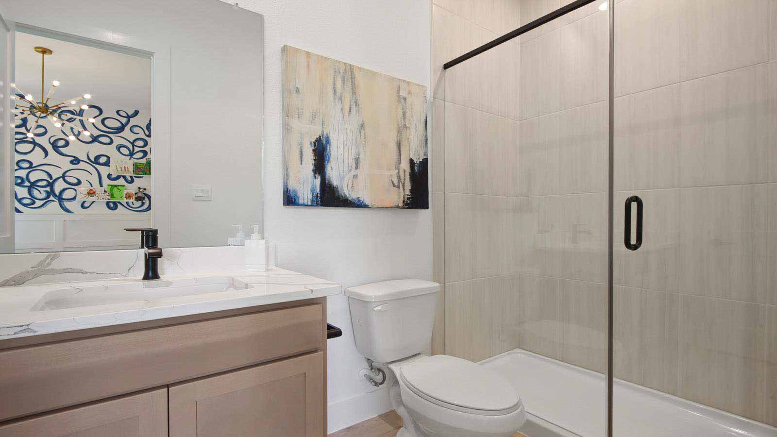 Secondary bathroom with stand alone shower with tile and semi frameless glass quartz counter tops in Pinehurst  TX