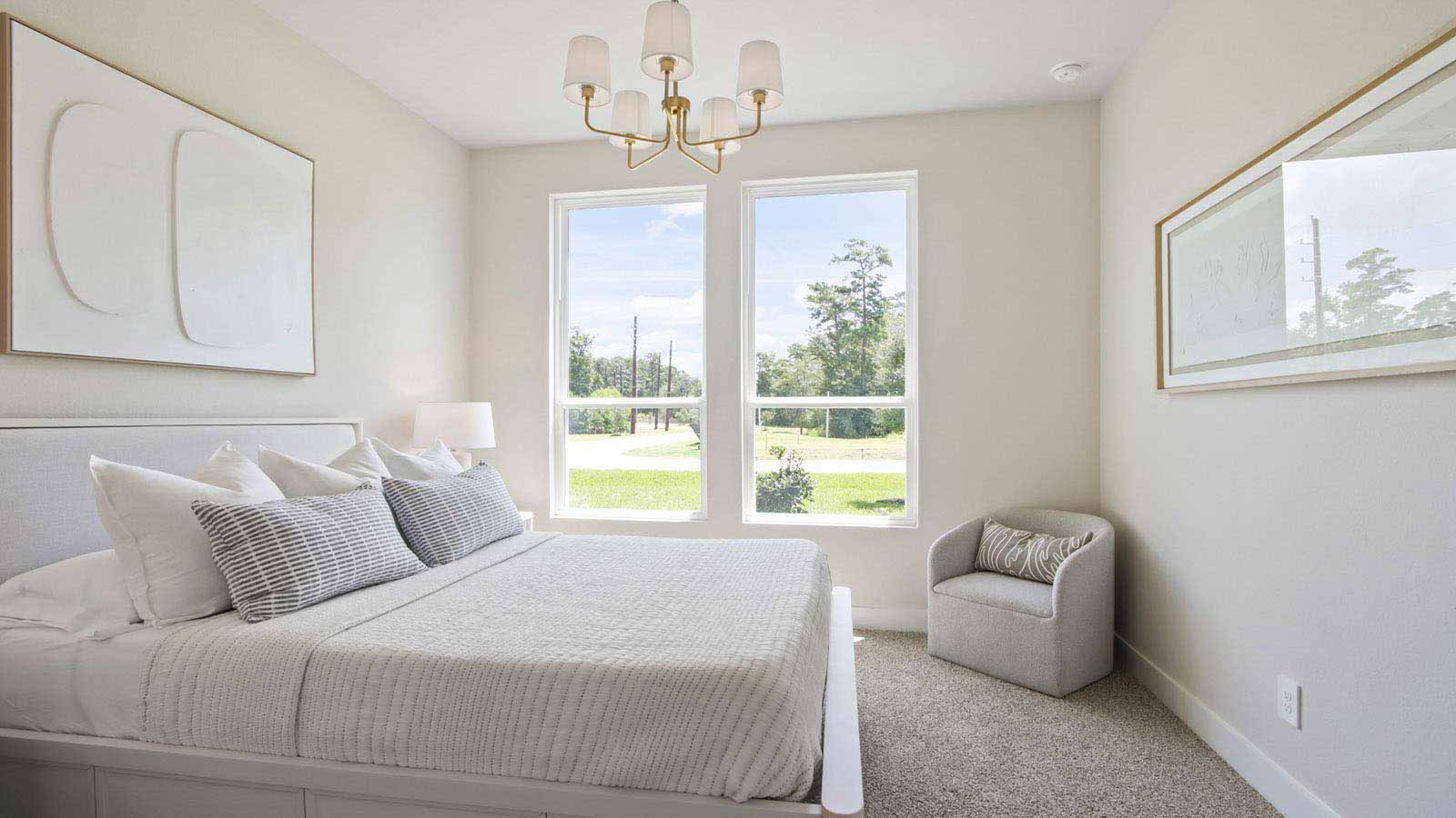 Secondary bedroom with shag carpet flooring and bright window