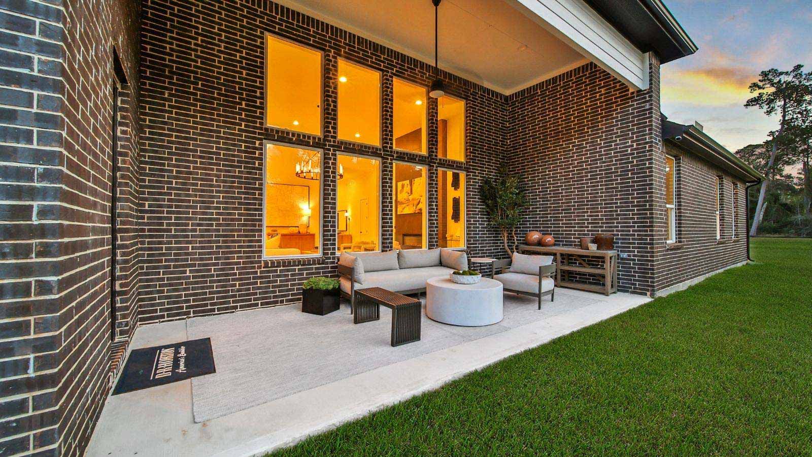 covered patio with jamies hardie siding and overhead lighting