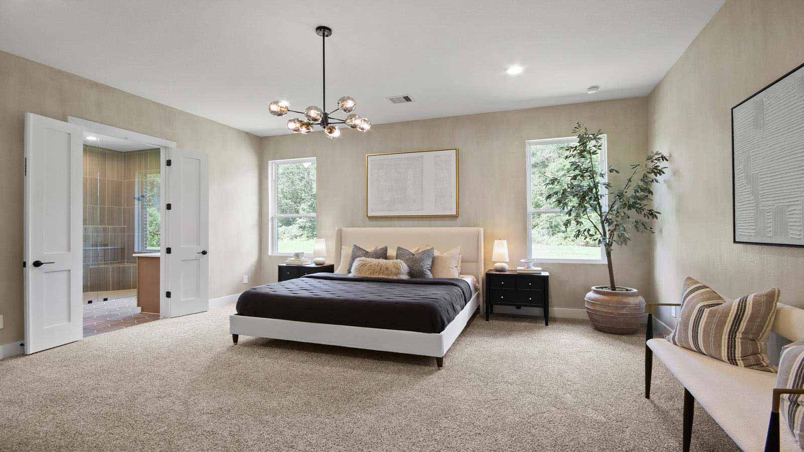 Primary bedroom with carpet flooring