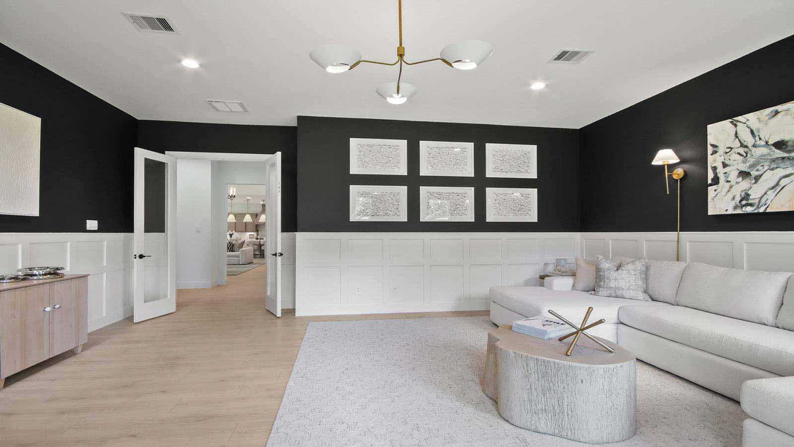 Spacious living area with vinyl flooring