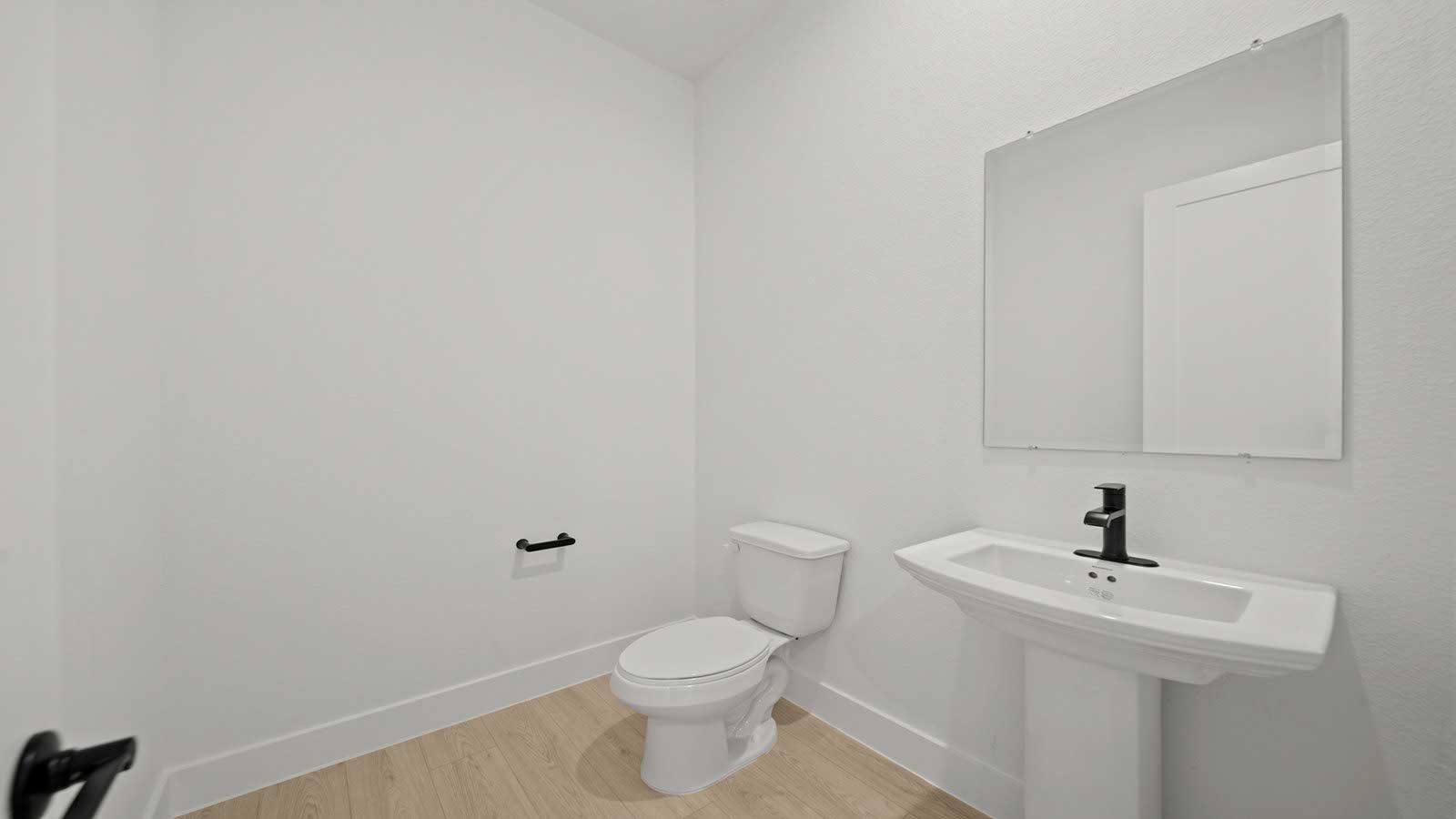 Powder bathroom with pedestal sink