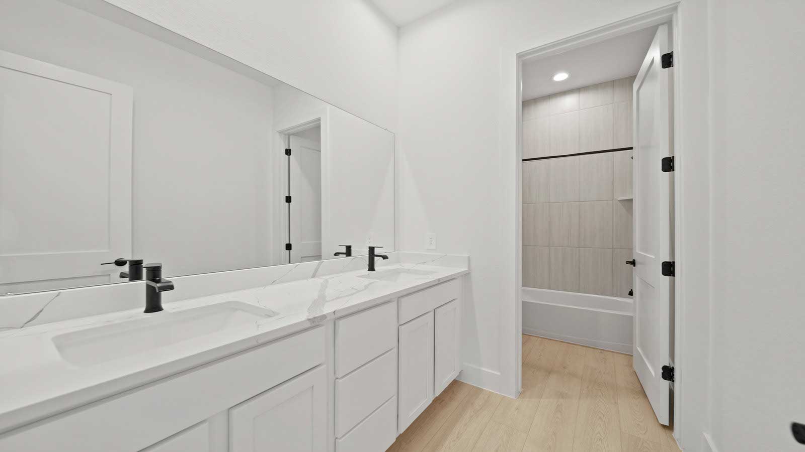 Secondary bedroom with carpet flooring