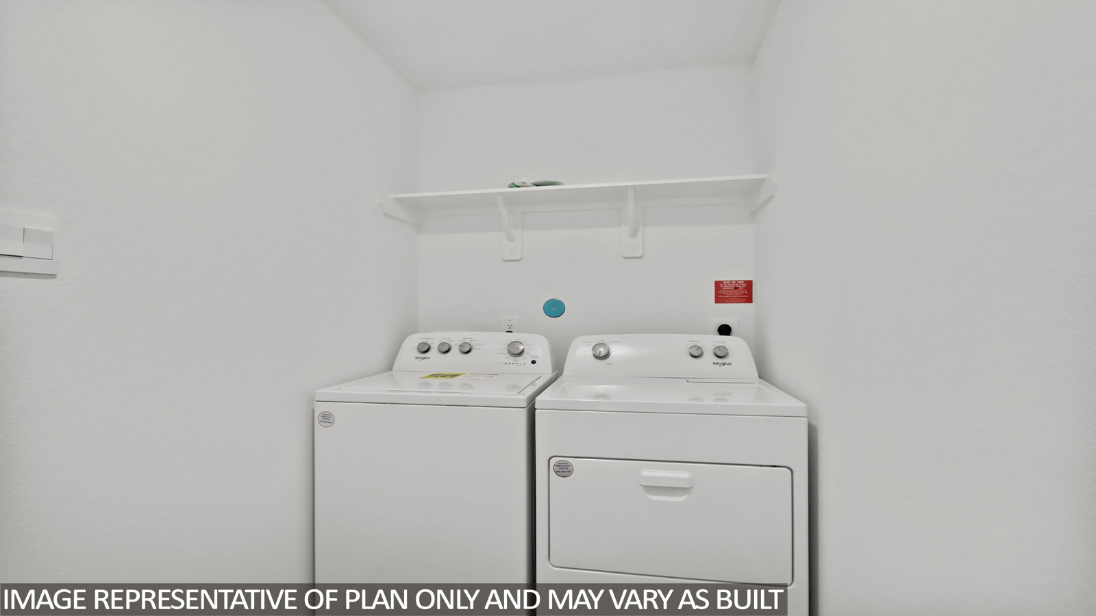 Utility room with vinyl flooring.