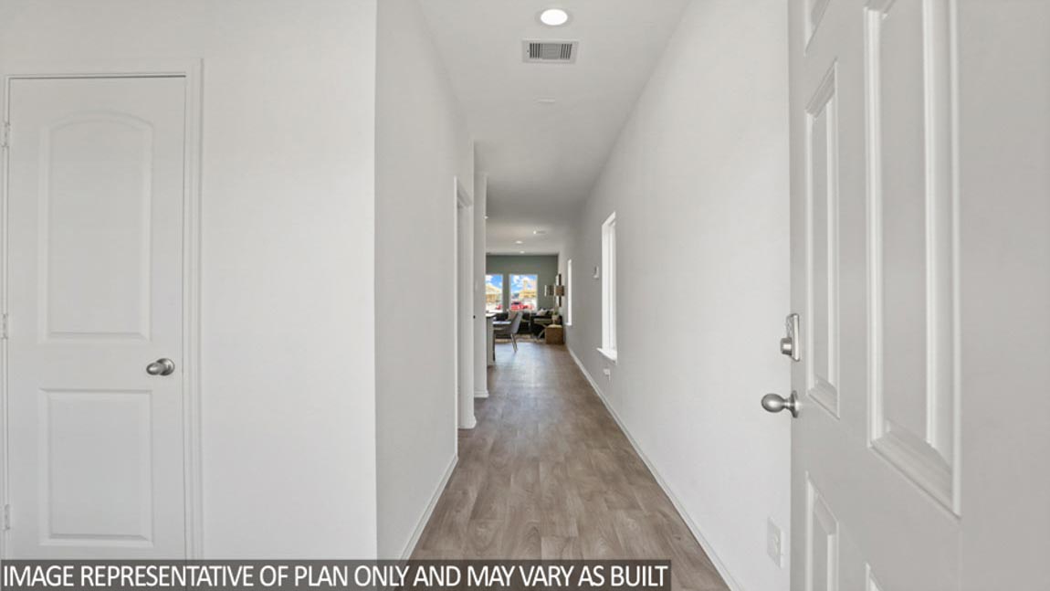 Entryway with vinyl flooring.