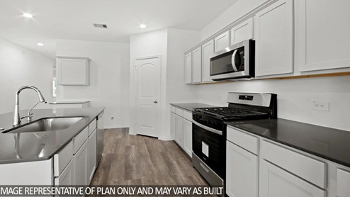 gourmet kitchen featuring granite countertops and Stainless steel appliances.