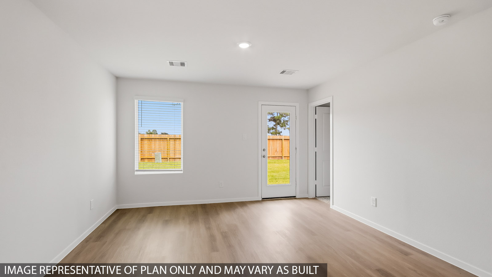 open concept living and dining area with vinyl flooring