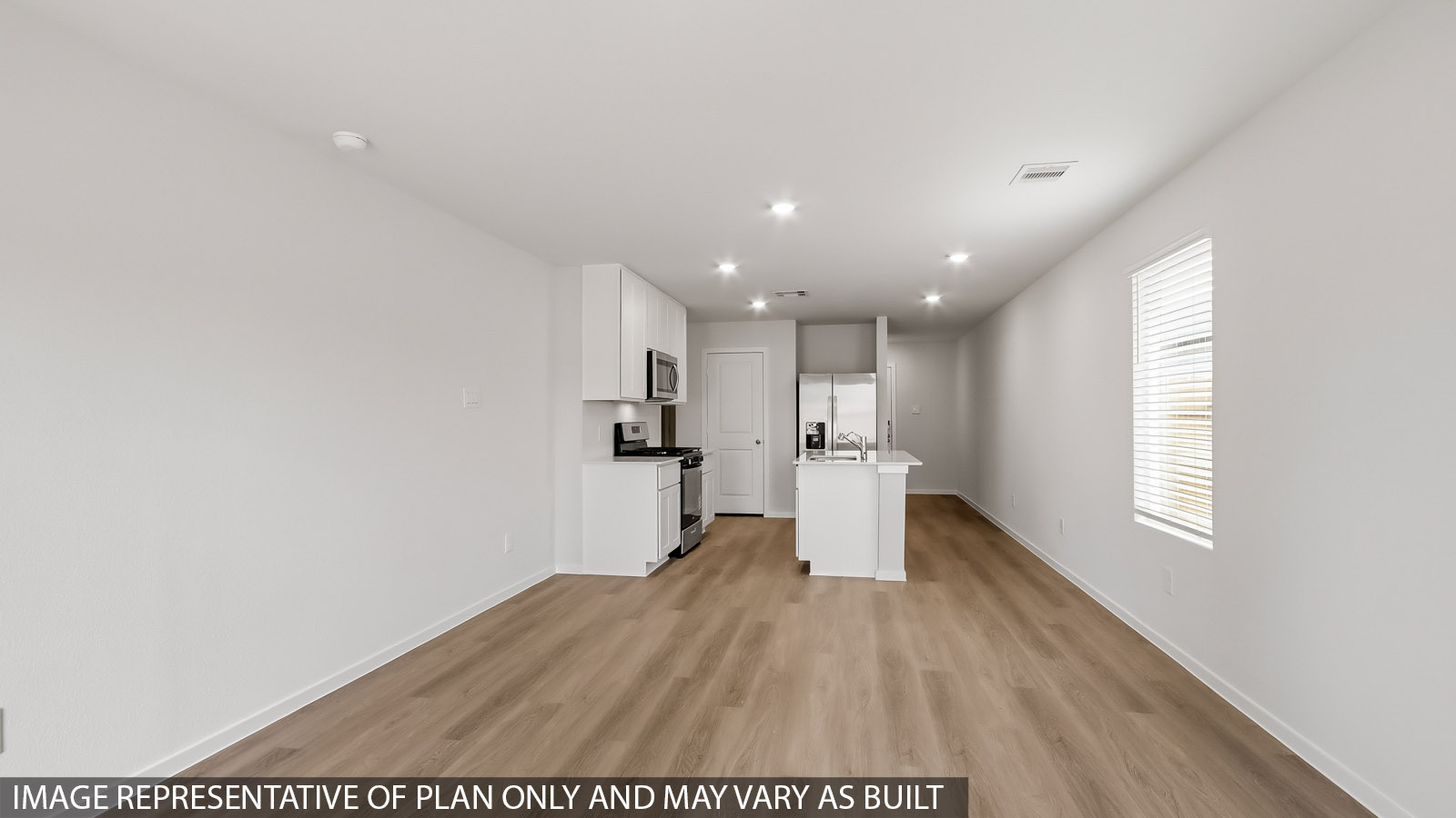 open concept living and dining area with vinyl flooring