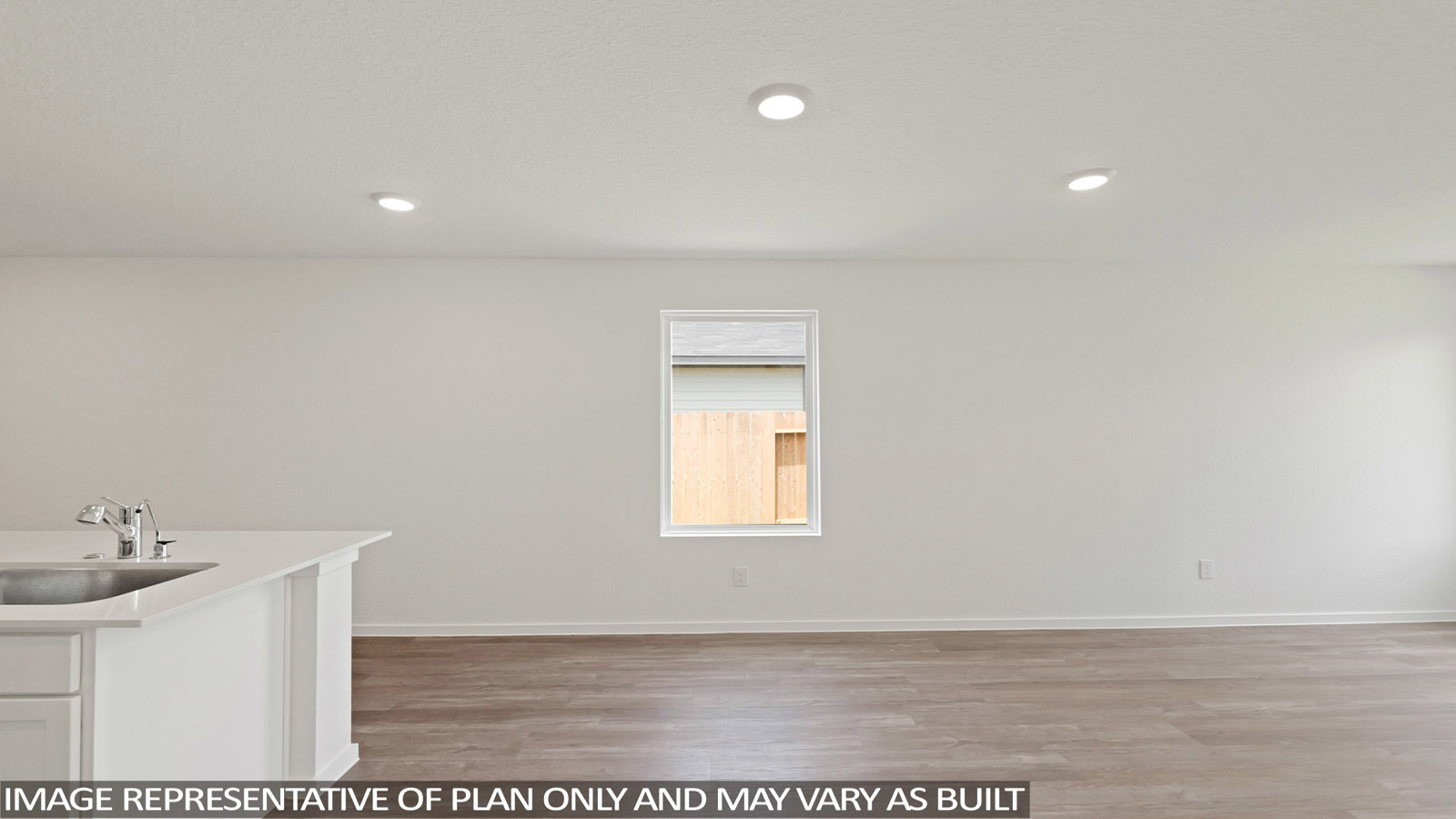 open concept living and dining area with vinyl flooring, stainless steel appliances, and quartz countertops in Hockley, Tx