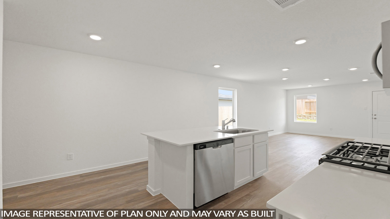 open concept living and dining area with vinyl flooring, stainless steel appliances, and quartz countertops in Hockley, Tx