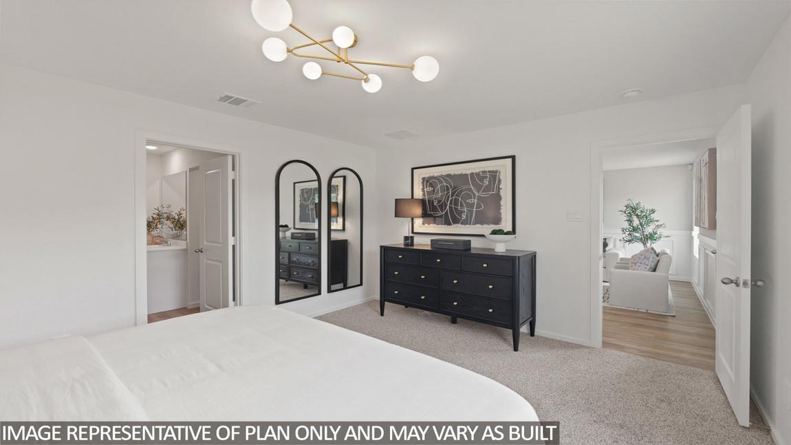 Large Primary bedroom with shag carpet flooring and bright window