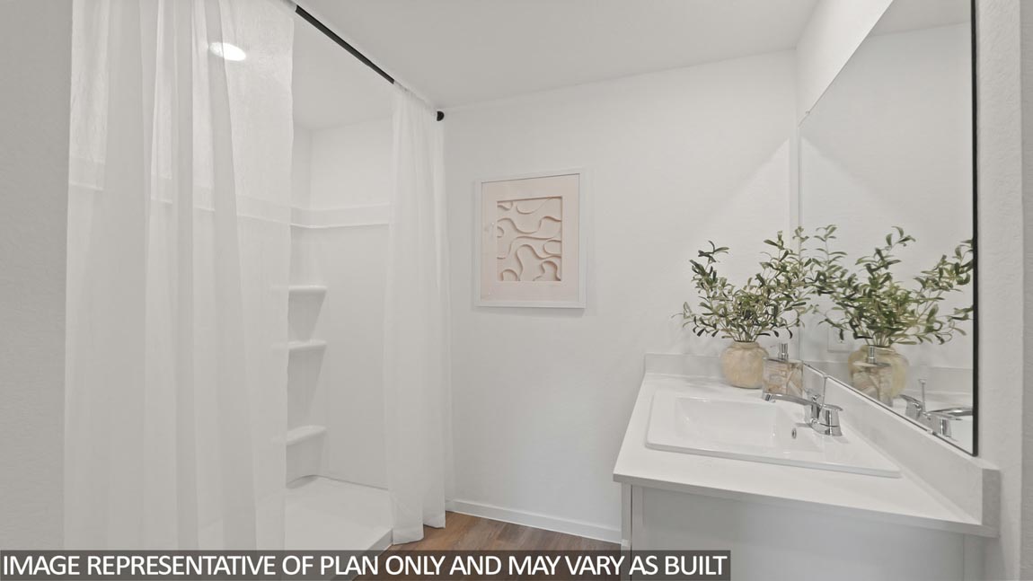 Primary bathroom with stand-alone shower with tiles and semi frameless glass in Hockley TX