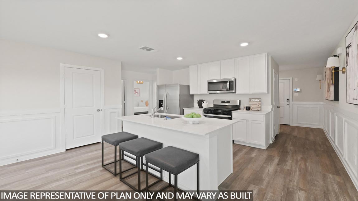 Kitchen with quartz countertops, modern hardware and an island and vinyl floor