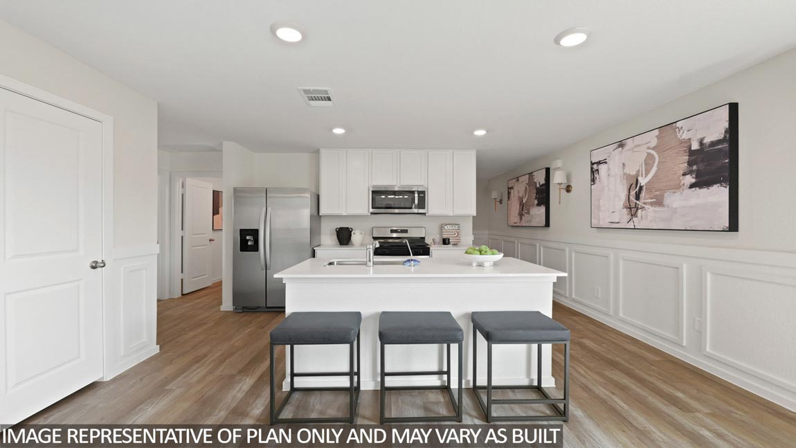 Kitchen with quartz countertops, modern hardware and an island and vinyl floor
