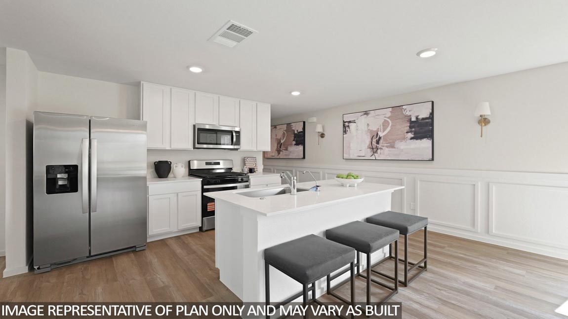 Kitchen with quartz countertops, modern hardware and an island and vinyl floor
