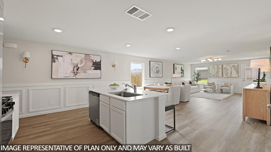 Kitchen with quartz countertops, modern hardware and an island and vinyl floor