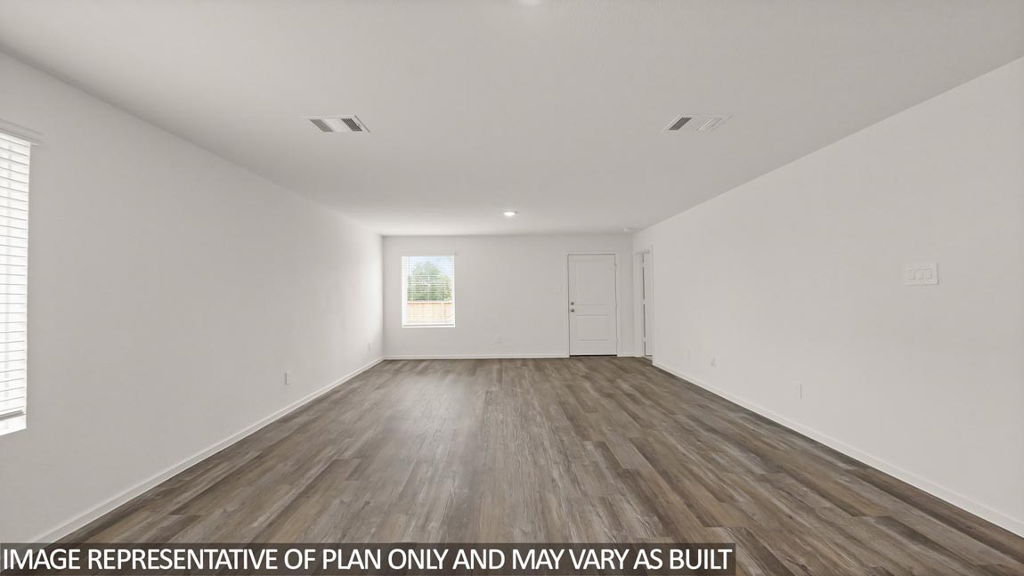 open concept living and dining area with vinyl flooring and large windows