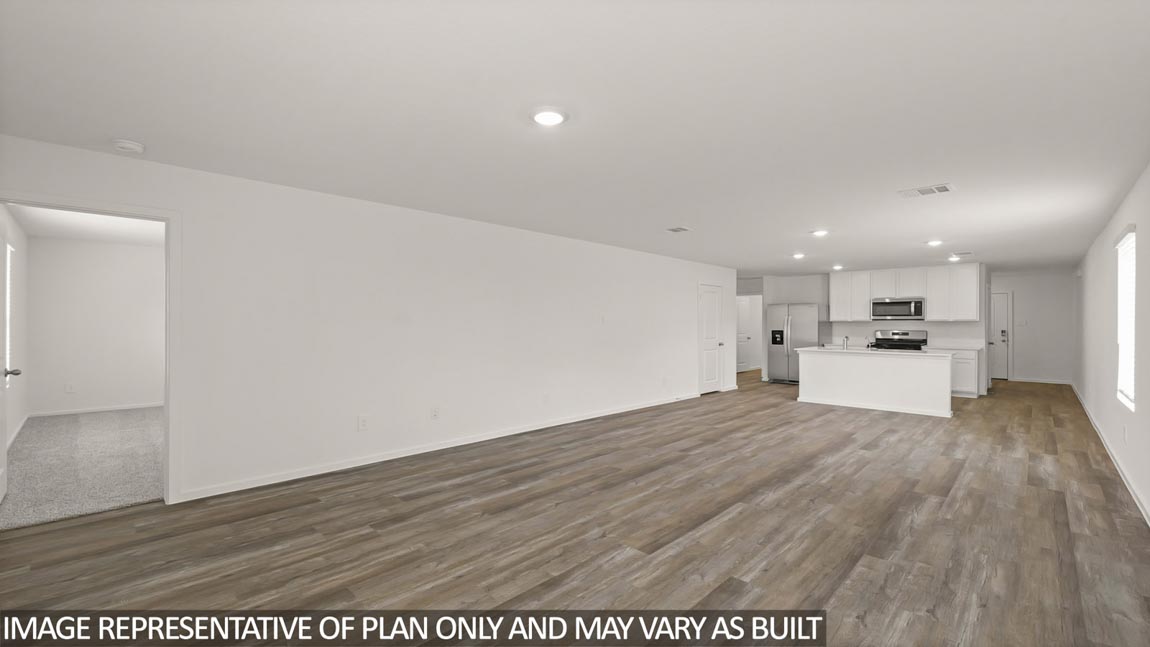 open concept living and dining area with vinyl flooring and large windows