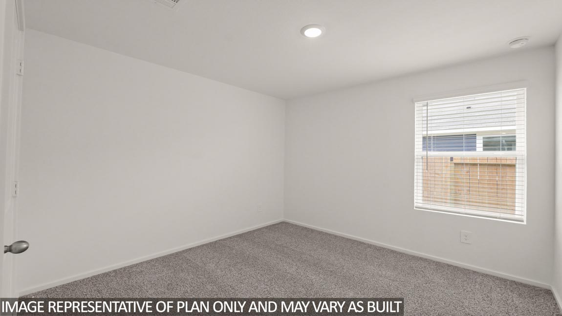 bedroom with carpet flooring and windows in Hockley, Texas