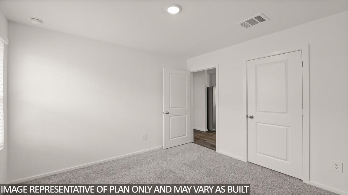 bedroom with carpet flooring and windows in Hockley, Texas