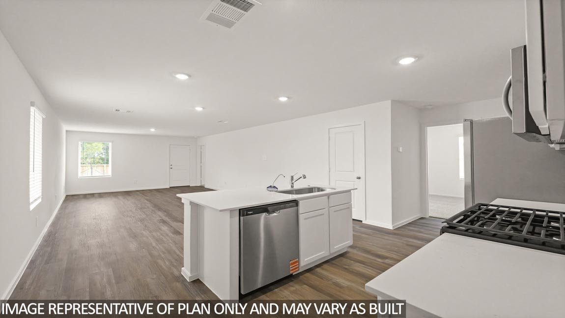 kitchen with stainless steel appliances and quartz countettops in Hockley, Texas