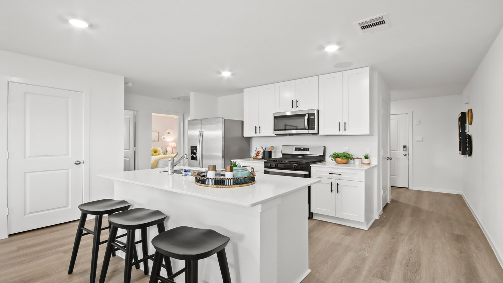 kitchen with quartx countertops and stainless steel appliances