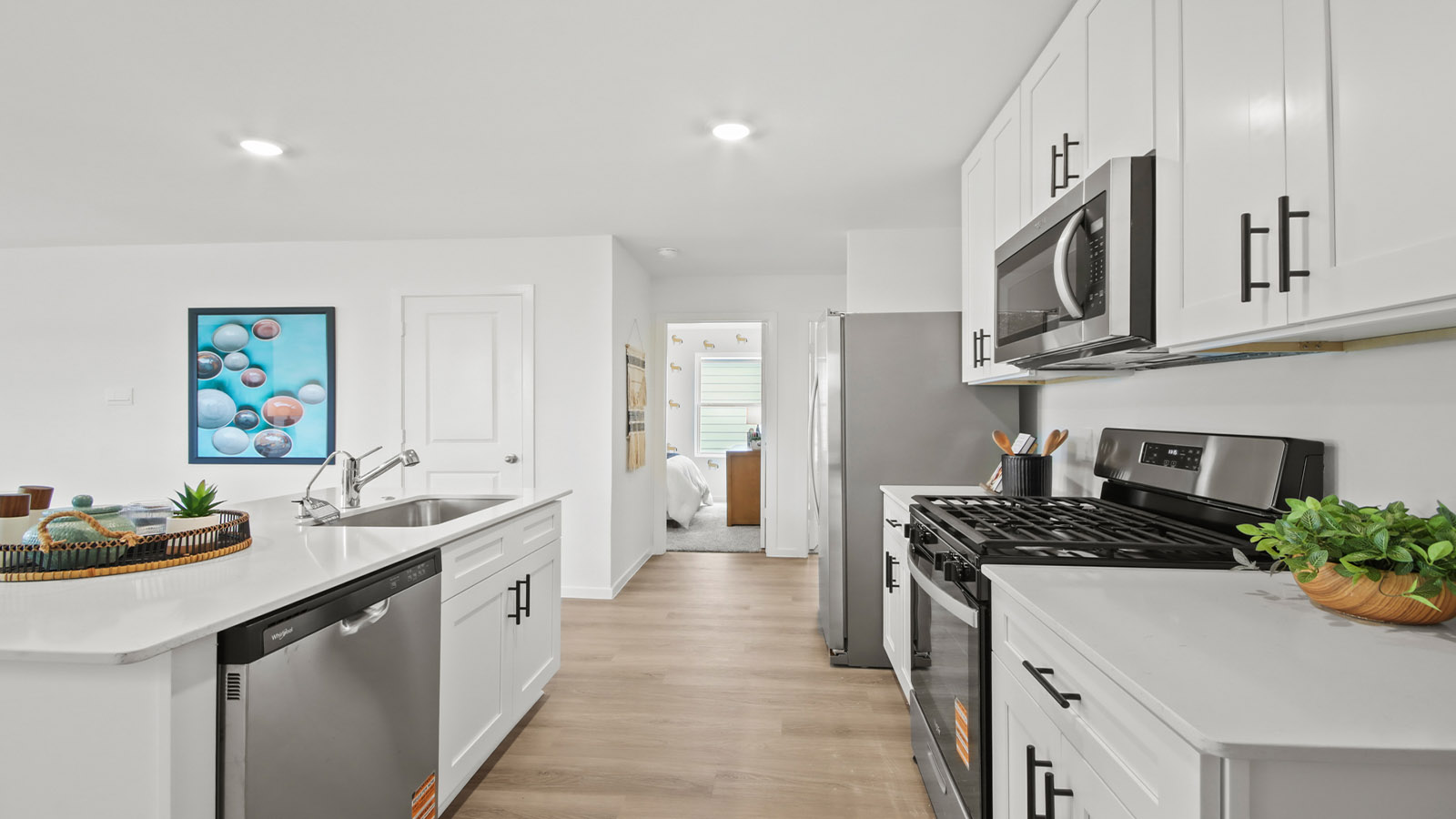 kitchen with quartx countertops and stainless steel appliances