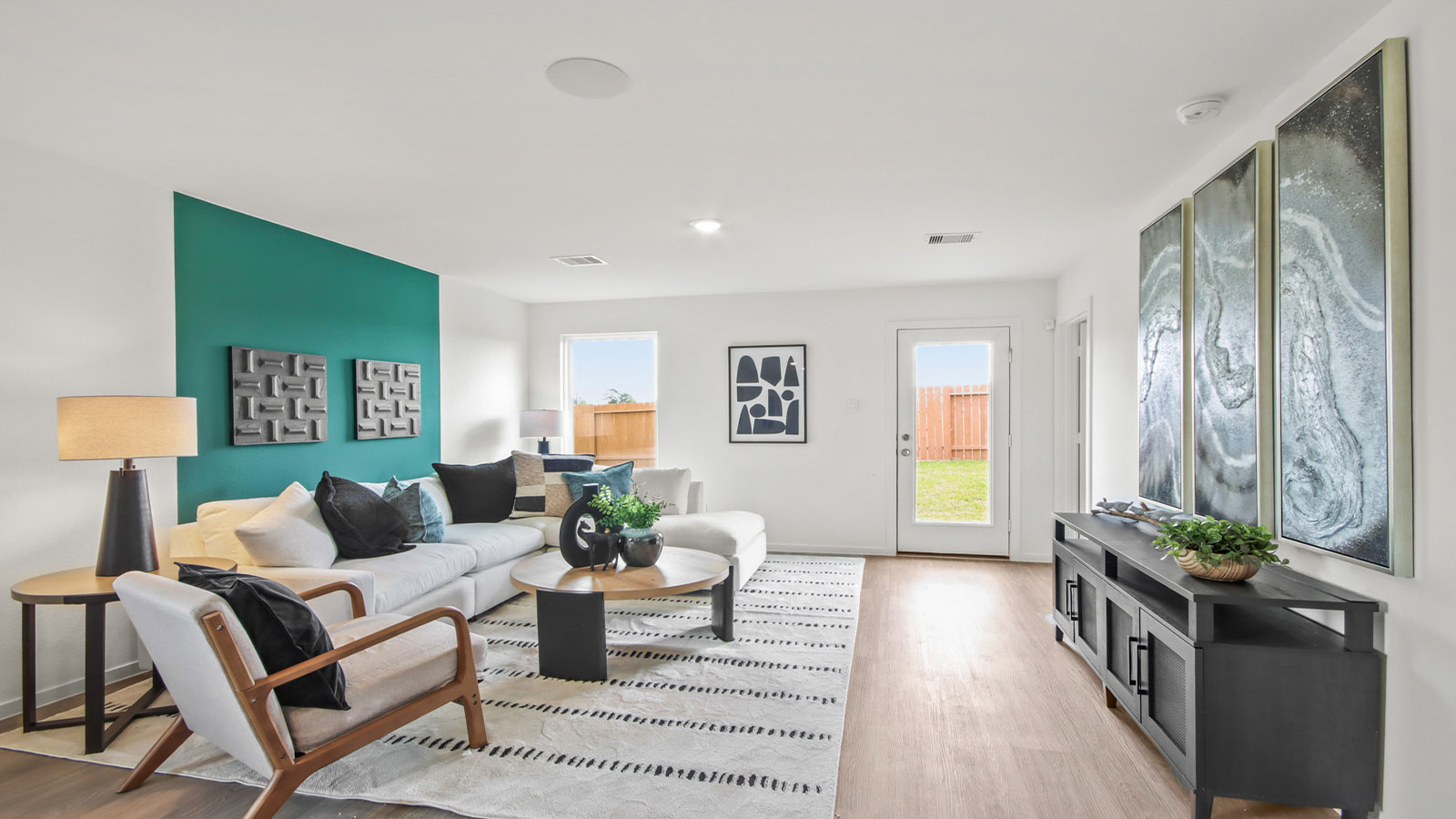 open concept livving and dining area with vinyl flooring and large windows