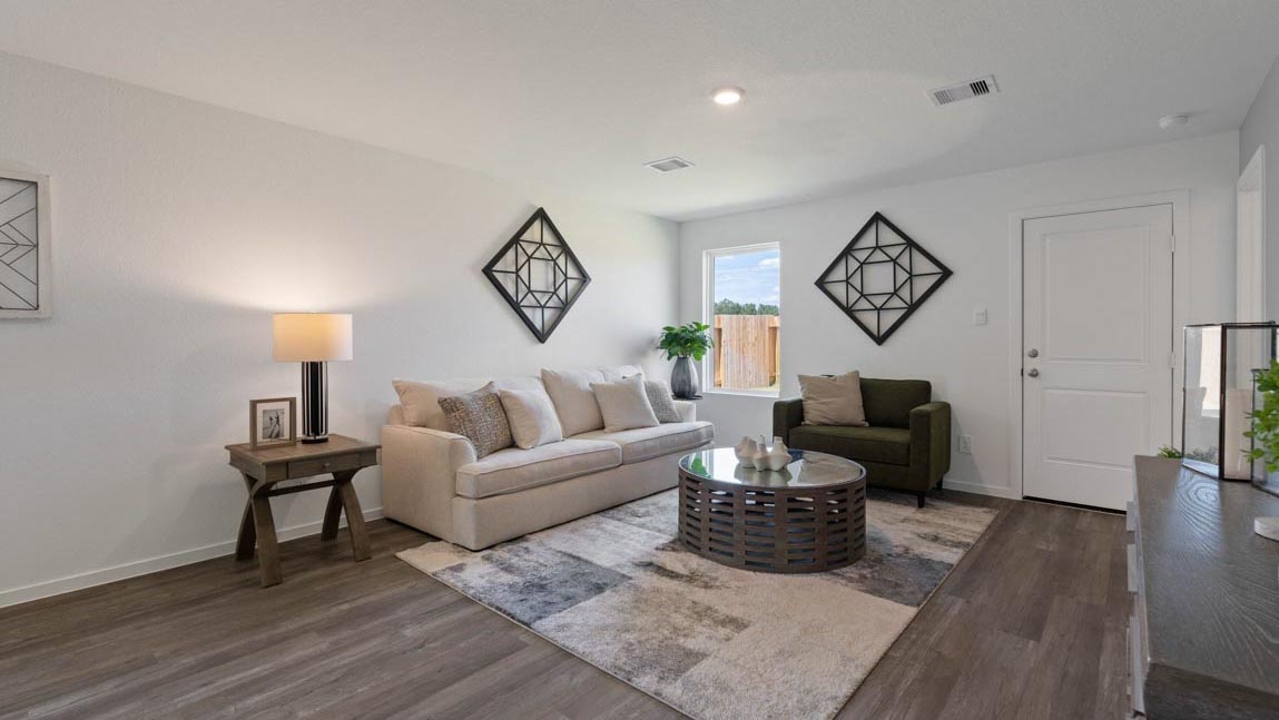 open concept livivng and dining area with vinyl flooring, quartz countertops, and large windows